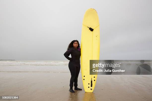 Woman with surfboard