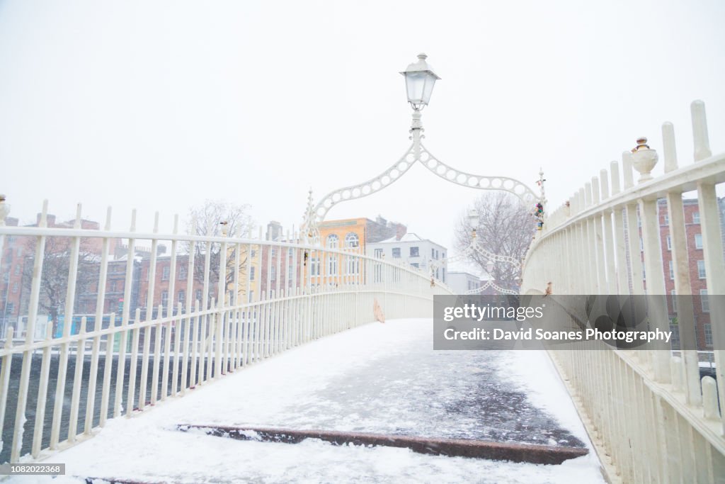 Snow on the Ha'penny bridge in Dublin City, Ireland