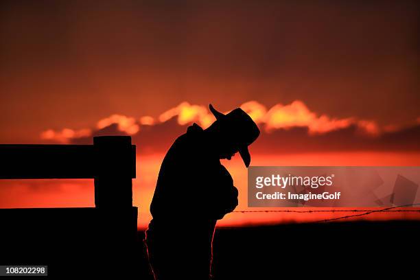 silhouette of sad cowboy - prairie silhouette stock pictures, royalty-free photos & images