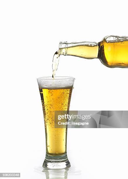 beer being poured in glass - beer pour stock pictures, royalty-free photos & images