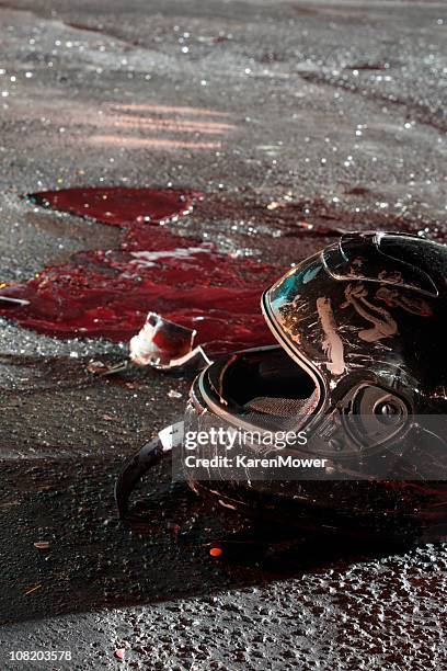 bloody helmet on pavement after crash - gory car accident photos stock pictures, royalty-free photos & images