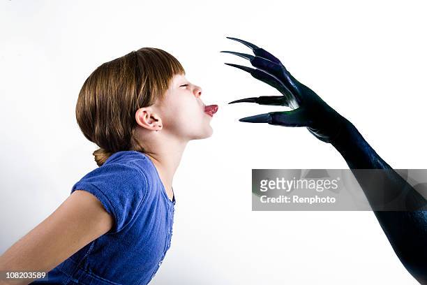 little girl facing her fear of monsters - schaar stockfoto's en -beelden