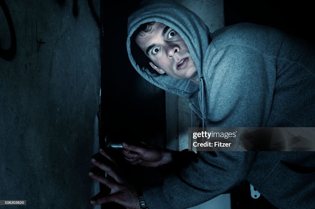 Burglar Man Outside House at Night
