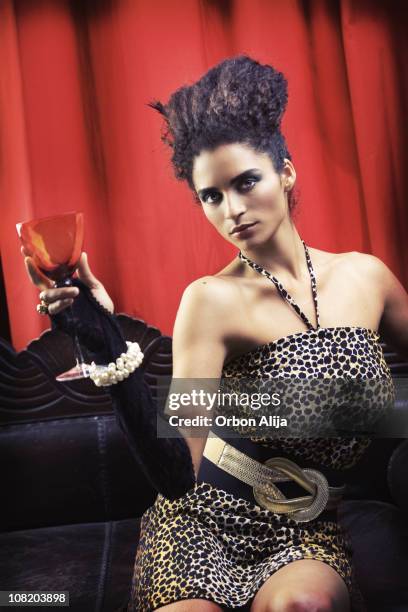 young woman wearing pearls and gloves holding glass - fashion glamour pearl stock pictures, royalty-free photos & images