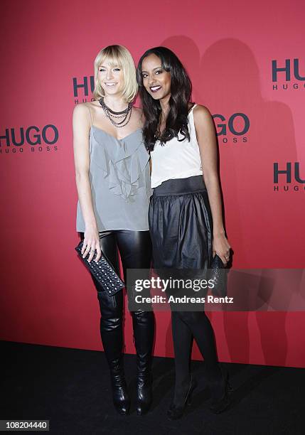 Model Lena Gercke and model Sara Nuru attend the Hugo Boss Show during the Mercedes Benz Fashion Week Autumn/Winter 2011 at Neue Nationalgalerie on...