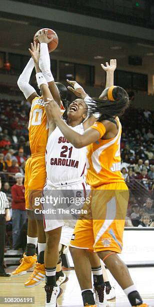 South Carolina's Ashley Bruner looses a rebound to Tennessee's Meighan Simmons and Glory Johnson during the first half at the Carolina Coliseum in...