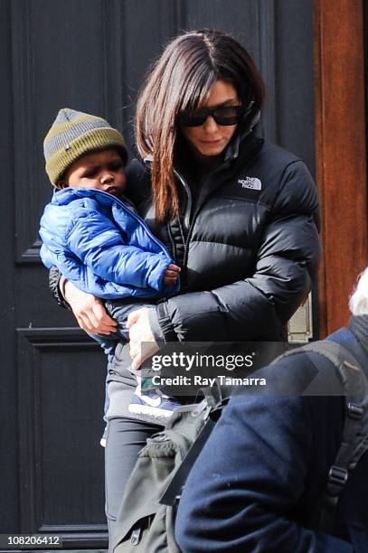 Actress Sandra Bullock and her son Louis Bullock leave their Soho home on January 20, 2011 in New York City.