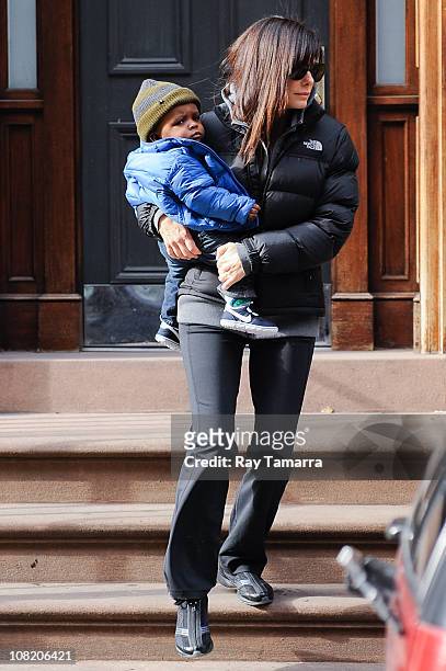 Actress Sandra Bullock and her son Louis Bullock leave their Soho home on January 20, 2011 in New York City.