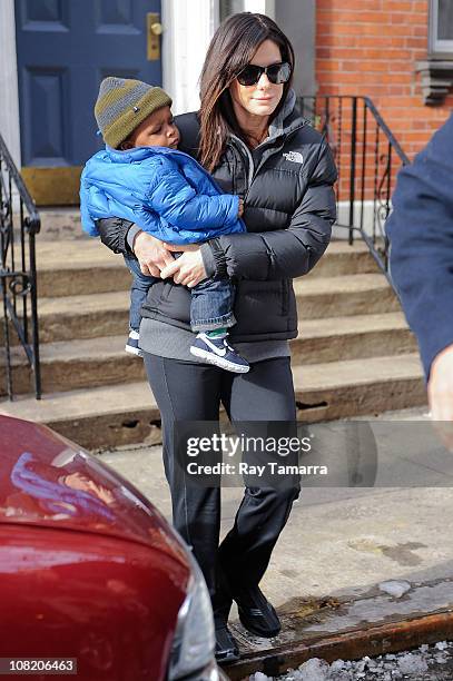 Actress Sandra Bullock and her son Louis Bullock leave their Soho home on January 20, 2011 in New York City.