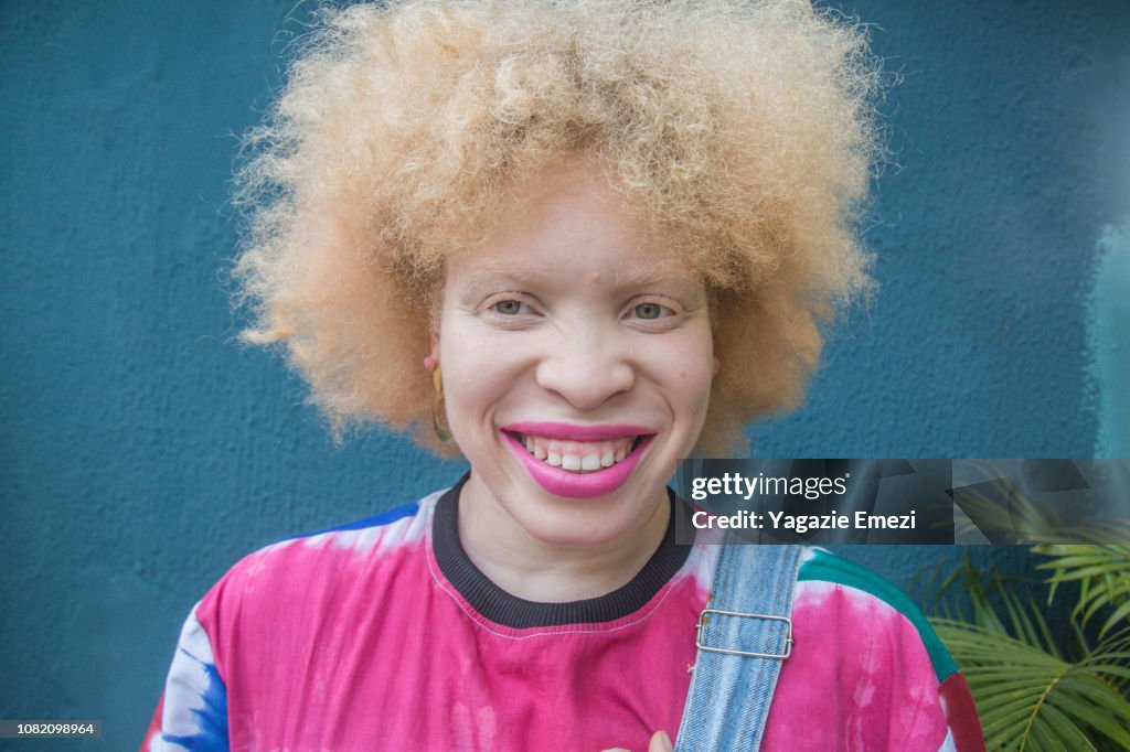 A blonde woman smiling