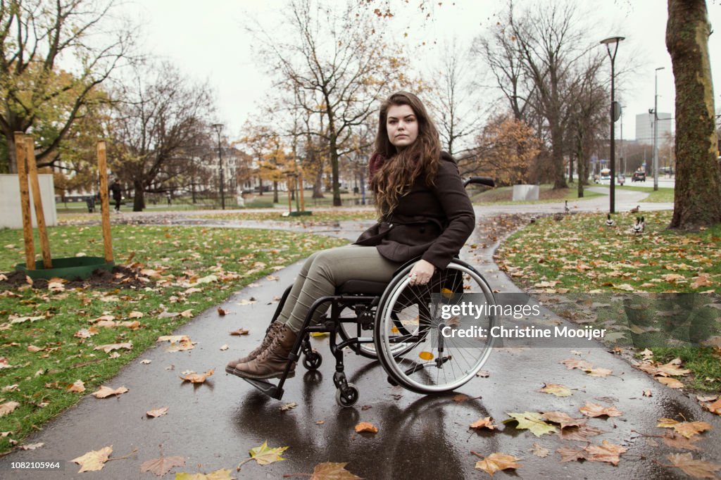 Portrait of young adult woman in wheelchair