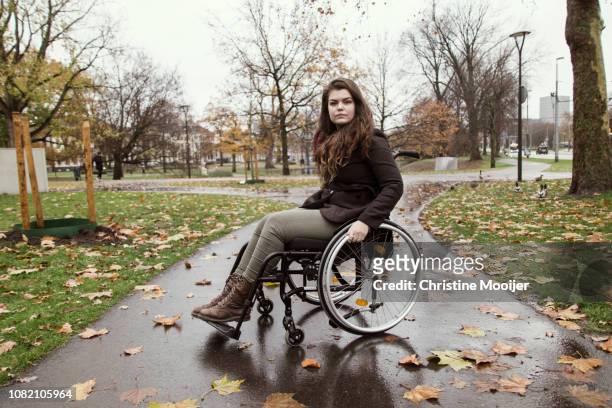 Portrait of young adult woman in wheelchair