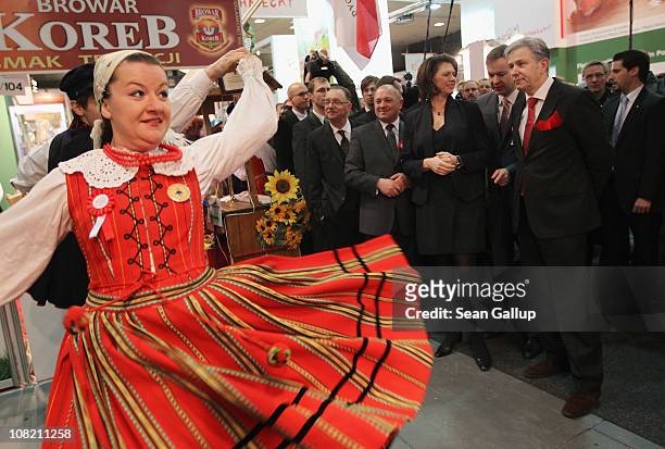 German Agriculture and Consumer Protection Minister Ilse Aigner and Berlin city mayor Klaus Wowereit watch a Polish folk dance ensmble perform while...