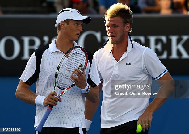 Samuel Groth and Greg Jones of Australia talk tactics in their second round doubles match against Oliver Marach of Austria and Lukasz Kubot of Poland...