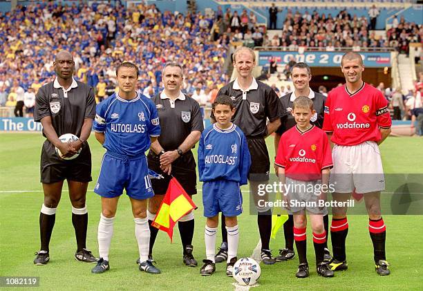 Captains, officials, and mascots line-up before the Charity Shield match between Chelsea and Manchester United played at Wembley Stadium, in London....