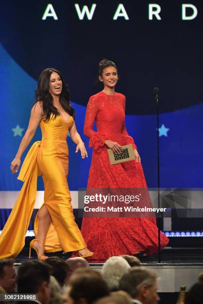 Jeanine Mason and Nina Dobrev walk onstage during the 24th annual Critics' Choice Awards at Barker Hangar on January 13, 2019 in Santa Monica,...