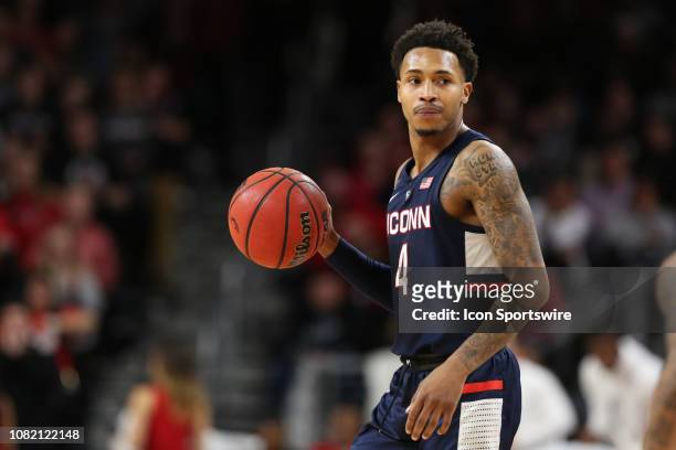 Connecticut Huskies guard Jalen Adams controls the ball during the game against the Connecticut Huskies and the Cincinnati Bearcats on January 12th...