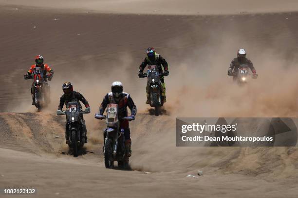 Nomade Racing No. 136 Motorbike ridden by Philippe Gendron of France, Team Dakaramoto No. 85 Motorbike ridden by Landry Maillet of France, Dragon...