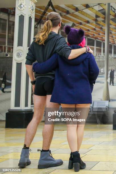 Couple are seen at the Paddington Station in their underwear during the 10th anniversary of 'No Trousers Tube Ride' event. The No Pants Subway Ride...