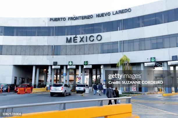 Vehicles and pedestrians enter Mexico from the US over the International Bridge into Nuevo Laredo in Laredo, Texas, on January 13, 2019. - Thousands...