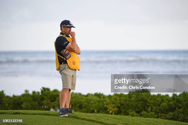 John Wood, caddie for Matt Kuchar waits on the 17th tee during the final round of the Sony Open in Hawaii at Waialae Country Club on January 13, 2019...