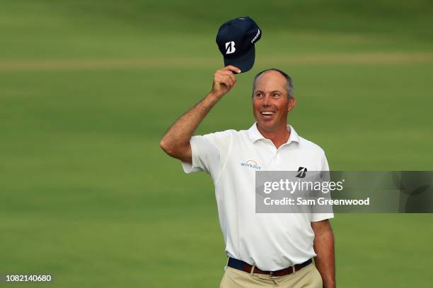 Matt Kuchar of the United States acknowledges the crowd as he walks to the 18th green during the final round of the Sony Open In Hawaii at Waialae...