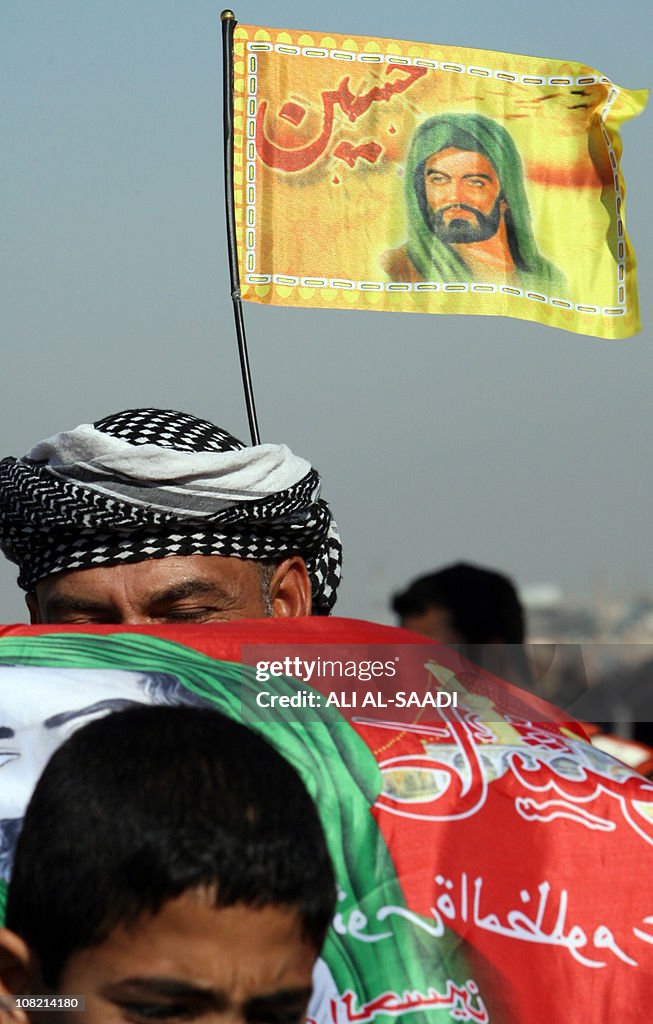 Shiite Muslim pilgrims march from Baghda