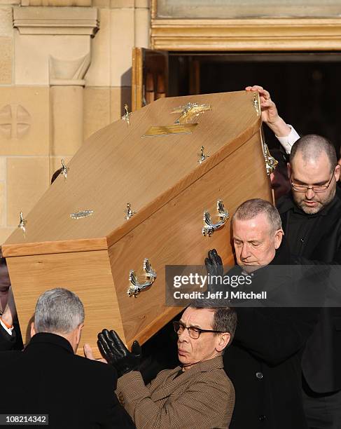 The coffin of Scottish singer songwriter Gerry Rafferty is carried from St Mirren Cathedral following his funeral service on January 21, 2011 in...