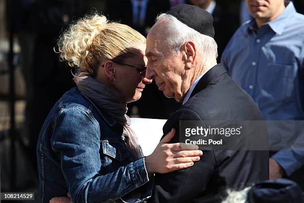 Israeli President Shimon Peres is comforted by his granddaughter Mika Almog during her funeral ceremony of his late wife Sonia on January 21, 2011 in...