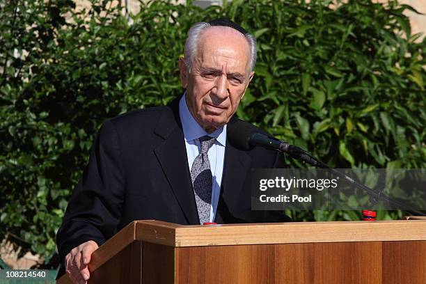 Israeli President Shimon Peres eulogizes his wife Sonia, during her funeral ceremony on January 21, 2011 in Ben Shemen, Israel. Thousands of people...