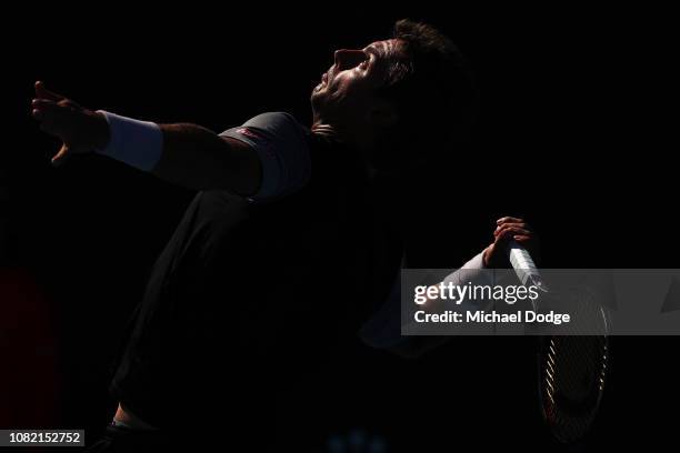 Henri Laaksonen of Switzerland serves in his first round match against Mirza Basic of Bosnia and Herzegovina during day one of the 2019 Australian...