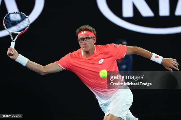 Denis Istomin of Uzbekistan plays a forehand his first round match against Roger Federer of Switzerland during day one of the 2019 Australian Open at...