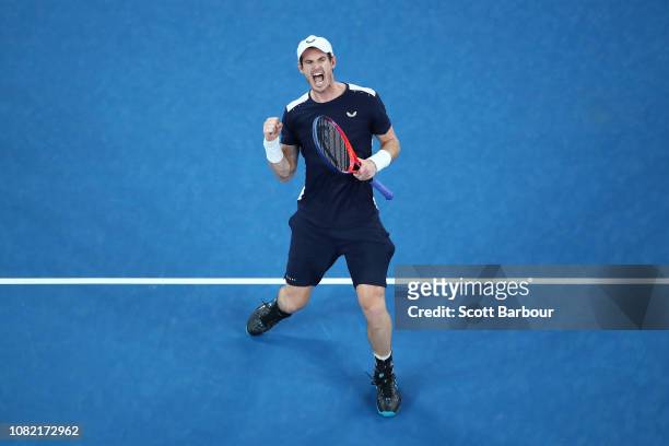 Andy Murray of Great Britain celebrates winning the third set in his first round match against Roberto Bautista Agut of Spain during day one of the...