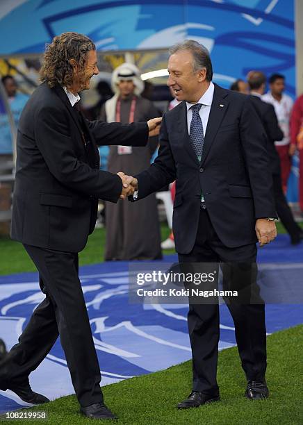 Japan coach Alberto Zaccheroni shakes hands with Qatari coach Bruno Metsu prior to the AFC Asian Cup quarter final match between Japan and Qatar at...