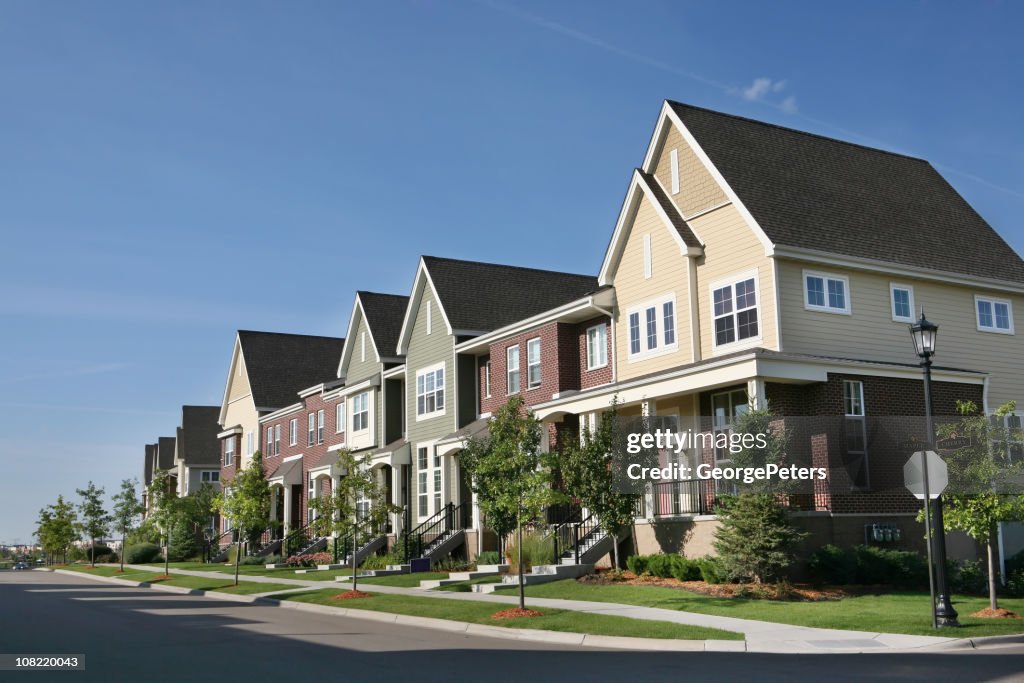 Row of Suburban Townhouses on Summer Day