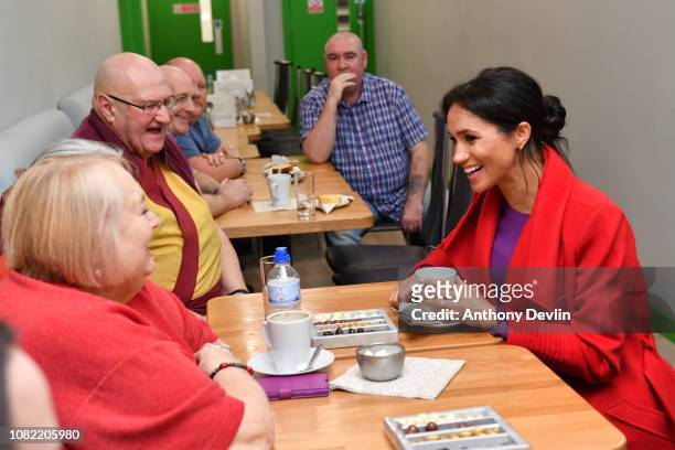 Meghan, Duchess of Sussex speaks with locals at 'Number 7', a 'Feeding Birkenhead' citizen’s supermarket and community cafe, on January 14, 2019 in...