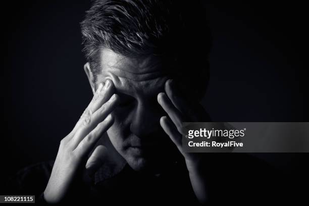 frustrated man putting his hands to his head - man headache bildbanksfoton och bilder
