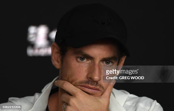 Britain's Andy Murray addresses media representatives at a press conference after defeat in his first round men's singles match against Spain's...