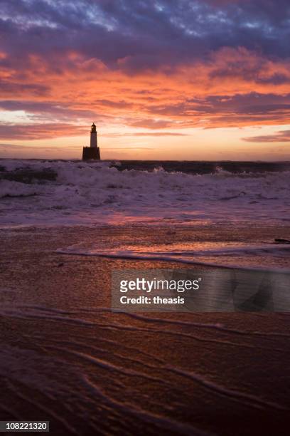 north sea lighthouse before dawn - theasis stock pictures, royalty-free photos & images