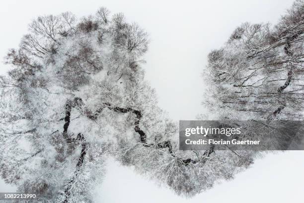 Aerial view to a small river in winter on January 11, 2019 in Reichenbach, Germany.