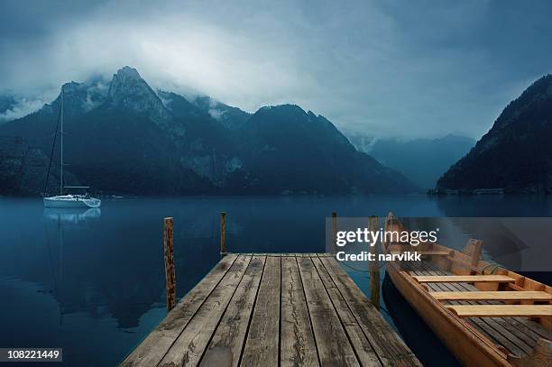 dark lake - jetty stock pictures, royalty-free photos & images