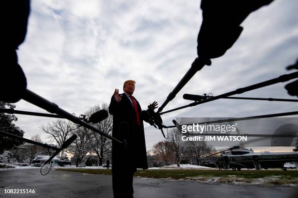 President Donald Trump speaks to the media as he departs the White House in Washington, DC, on January 14, 2019 en route to New Orleans, Louisiana to...