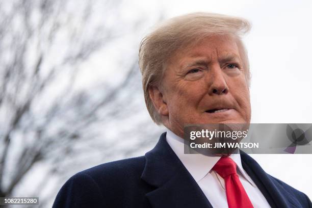 President Donald Trump speaks to the media as he departs the White House in Washington, DC, on January 14, 2019 en route to New Orleans, Louisiana to...