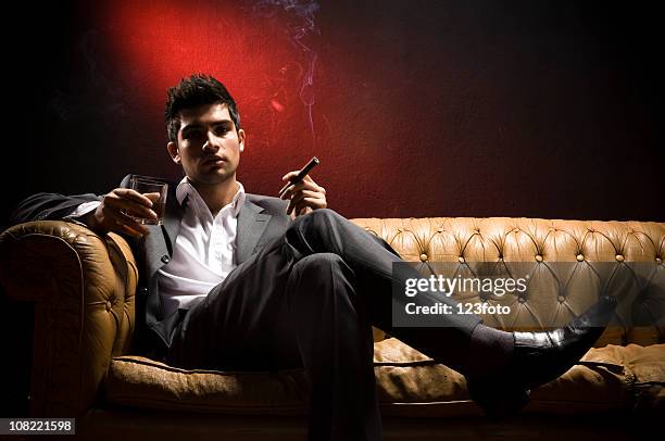 attractive young man - smoking cigar stock pictures, royalty-free photos & images