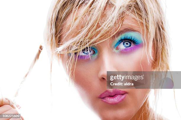 young woman posing with colorful and bright eye make-up - damp lips stock pictures, royalty-free photos & images