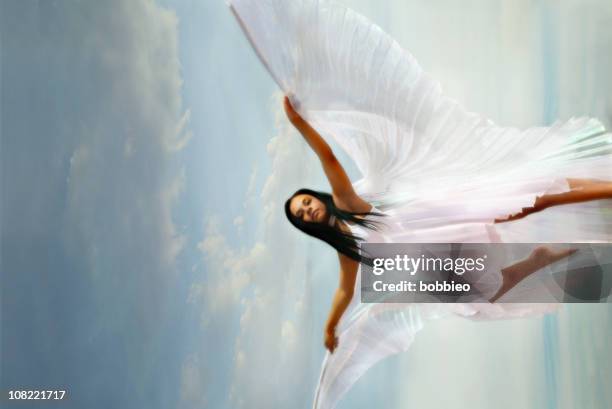 woman wearing white dress with wings - isis egyptian goddess stock pictures, royalty-free photos & images