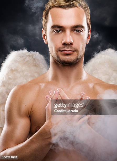 man wearing angel wings - touched by an angel stockfoto's en -beelden