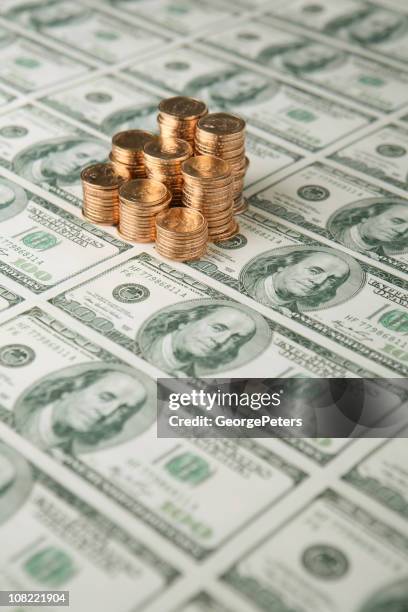 sheet of $100 bills and gold coins - one us dollar coin stock pictures, royalty-free photos & images