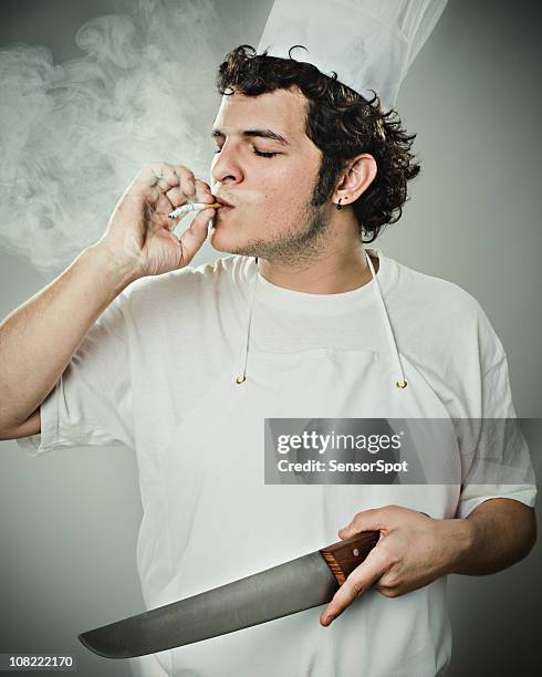 chef smoking and holding knife - grotesque stock pictures, royalty-free photos & images