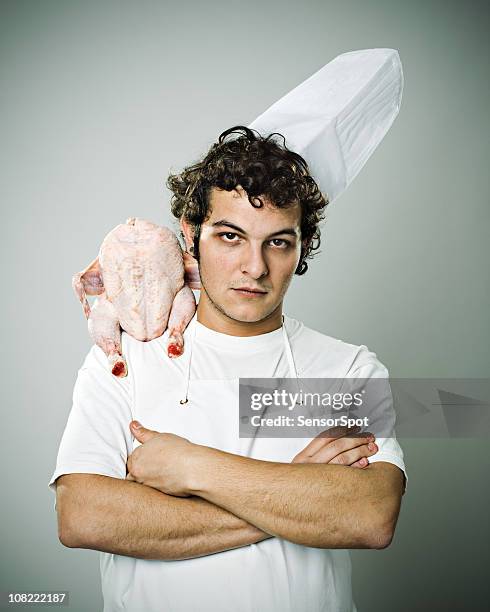 chef with raw chicken on shoulder - raw chicken stockfoto's en -beelden
